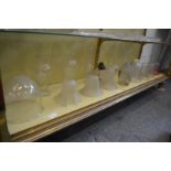 Various glass lamp shades and oil lamp chimneys etc.