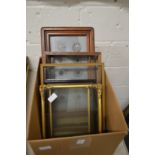 A box containing various small frames.