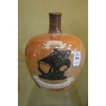 A Doulton salt glazed jug with moulded decoration 'Special Highland Whisky'.