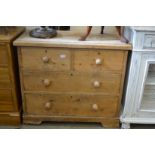 A small pine chest of drawers.