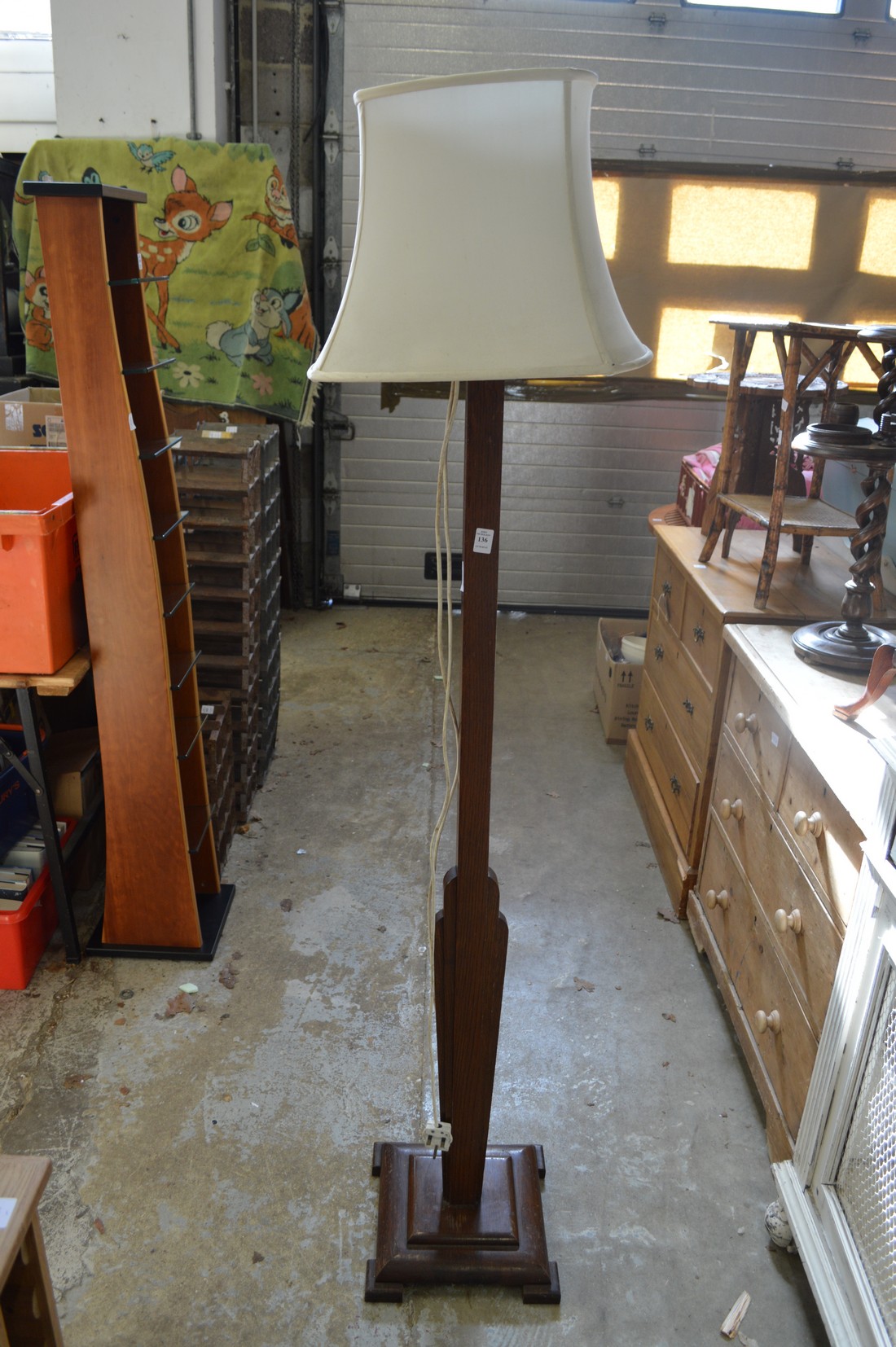 An art deco oak floor standing lamp.