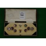 A cased set of cufflinks and dress studs.