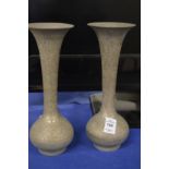 A pair of Islamic metal vases.