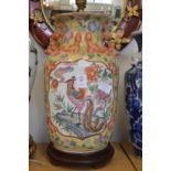 A large Chinese vase lamp.