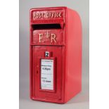 A RED PAINTED CAST IRON REPLICA POST OFFICE BOX. 1ft 11ins high, 9ins wide.