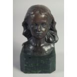 A SMALL BRONZE BUST OF A GIRL on a marble base. 5ins high.