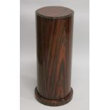 AN ART DECO STYLE REDWOOD PEDESTAL COLUMN.