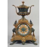A 19TH CENTURY FRENCH ORMLOU AND GILT METAL CLOCK with urn finial, striking on a single bell,