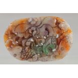 A CARVED AND PIERCED MULTI JADE PENDANT.