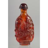 A CHINESE CARVED AMBER SNUFF BOTTLE. 3ins