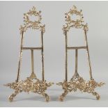 A PAIR OF BRASS EASELS. 22ins long.