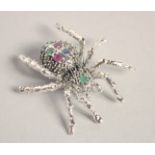 A LARGE SILVER RUBY, SAPPHIRE AND EMERALD SPIDER BROOCH.