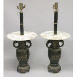 AN UNUSUAL PAIR OF JAPANESE BRONZE AND MARBLE LAMP TABLES, the bases modelled as decorative urns