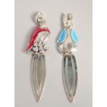 A PAIR OF SILVER AND ENAMEL BEATRIX POTTER BOOK MARKS.