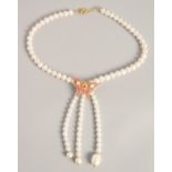 A PEARL NECKLACE with GOLD PLATED BUTTERFLY CLASP.