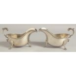 A PAIR OF HEAD SILVER SAUCEBOATS with gadrooned rim and three claw feet. Birmingham 1933. Maker: B B