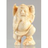 A CARVED BONE NETSUKE, FISHERMAN.