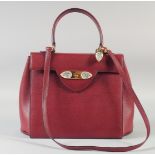 A SUPERB LALIQUE BURGUNDY LEATHER HAND BAG with three LALIQUE glass flowers. 34cm wide x 23cm high.