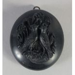 A GOOD VICTORAIN JET OVAL LOCKET carved with two birds. 1.75ins x 1.5ins, 20gms.
