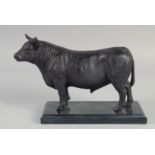 A GOOD BRONZE OF A BULL on a marble base. 9ins long.
