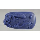 A LAPIS PENDANT carved with fishes. 2.5ins high.