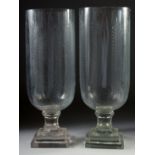 A GOOD PAIR OF ETCHED GLASS HURRICANE LAMPS on square bases.