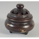 A SMALL CHINESE BRONZE GOLD SPLASH CIRCULAR CENSER AND COVER. 3.5ins diameter.