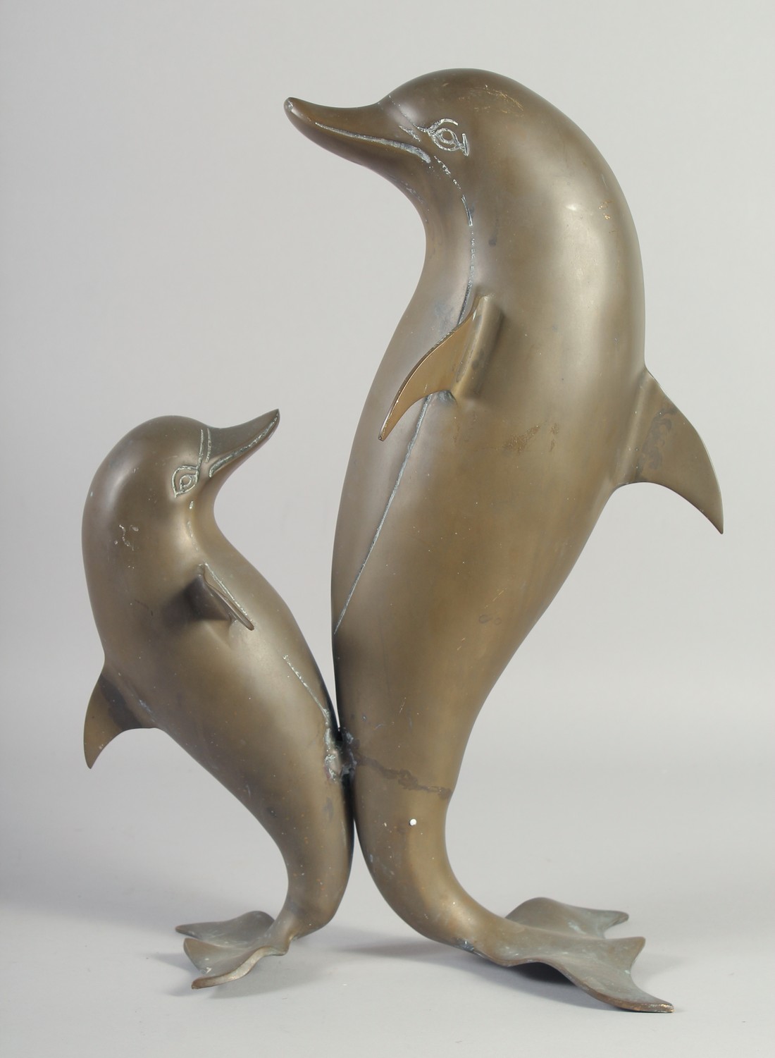 A MODERN ART BRONZE OF TWO DANCING DOLPHINS. 18ins high.