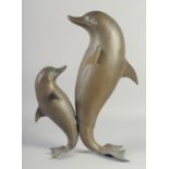 A MODERN ART BRONZE OF TWO DANCING DOLPHINS. 18ins high.