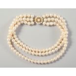 A THREE ROW PEARL NECKLACE AND CLASP set in 9ct gold.