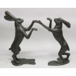 AN IMPRESSIVE PAIR OF BRONZE BOXING HARES.. 2ft 9ins high.