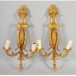 A PAIR OF GILT BRONZE TWO LIGHT WALL SCONCES.