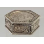 A CHINESE HEXAGONAL WHITE METAL COIN BOX. 1.5ins