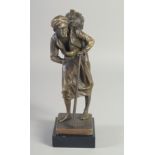 A BRONZE OF AN ARAB MAN on a marble base. 9ins high.