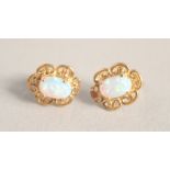 A PAIR OF SILVER 9CT GOLD OPAL FILIGREE EAR STUDS.