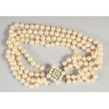 A GOOD FOUR ROW PEARL CHOKER AND CLASP.