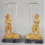 A PAIR OF ORMOLU AND GLASS FIGURAL VASES with blue John style bases. 9ins high.