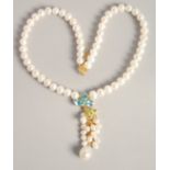 A PEARL NECKLACE with blue topaz and emerald necklace.