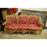 A FRENCH STYLE GILTWOOD SOFA. 7ft long.