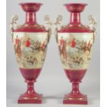 A LARGE PAIR OF CONTINENTAL BURGUNDY TWO HANDLED VASES with hunting scenes. 19ins high.