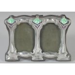 A SMALL SILVER ART NOUVEAU STYLE DOUBLE FRAME 3ins x 4ins.