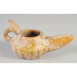 AN 8TH-9TH CENTURY UMAYYAD YELLOW GLAZED POTTERY OIL LAMP, 13.5cm spout to handle.