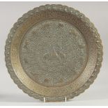 A FINE ISLAMIC EMBOSSED AND CHASES COPPER DISH, with various animals and foliate decoration, 36cm