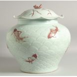 A LARGE CHINESE CELADON AND UNDERGLAZE RED JAR AND COVER, decorated with fish on carved scale
