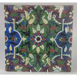 A FINE AND UNUSUAL LARGE 19TH CENTURY INDIAN TILE, with floral motif, 30.5cm square.