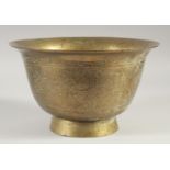 A CHINESE ENGRAVED AND CHASED BRASS BOWL, 27.5cm diameter.