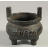 A CHINESE BRONZE CENSER, with Islamic calligraphy, character mark to base, 9.5cm diameter.