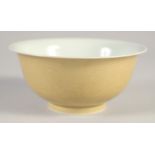 A CHINESE YELLOW GLAZE PORCELAIN DRAGON BOWL, six-character mark to base, 14.5cm diameter.