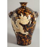 A CHINESE JIZHOU POTTERY DRAGON VASE, with molded twin handles, 29.5cm high.