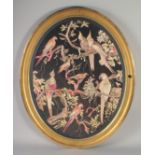 A 19TH CENTURY EUROPEAN SILK OVAL PANEL, with exotic birds on branches, encased within gilt frame,